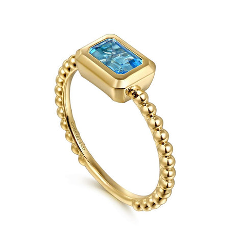 Gabriel & Co. 14k Yellow Gold Bujukan Bezel Set Blue Topaz and Beaded Shank Ring